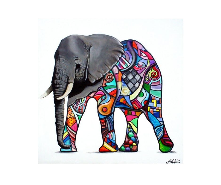 An acrylic painting of an elephant standing on a white background. The elephant's head and trunk are realistically rendered in shades of gray. The body, legs, and tail are covered in a vibrant, complex geometric and abstract pattern using bright colors like red, orange, yellow, green, blue, and purple, giving the appearance of a colorful metamorphosis.