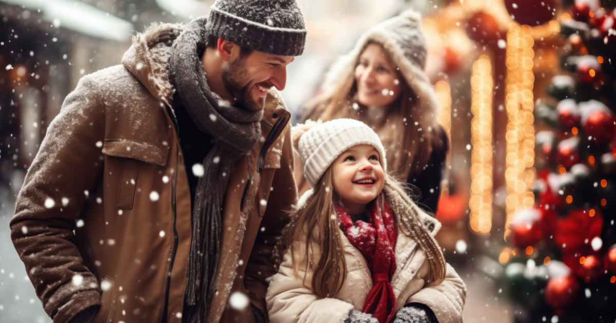 Father taking his daughter to look at holiday decorations